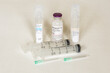 Materials for an intravenous injection including saline, sterile water, antibiotic, syringes and needles