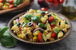 A bowl with traditional Italian pasta salad