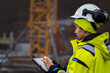 © Johnér - Female engineer using digital tablet at building site