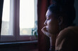 © Johnér - Pensive young woman sitting at home
