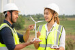© anusak - engineer team working in wind turbine farm. Renewable energy with wind generator by alternative energy concept.