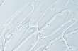 © Inna Dodor - Texture of face serum. Abstract background of moisturising transparent gel.