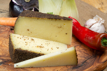 Cheese collection, aged hard Italian sheep cheese black pecorino from Sicily island or pecorino nero di Sicilia