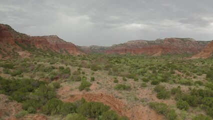 Wall Mural - Panoramic view of vast canyon landscape at Caprock Canyons State Park in west Texas - 4K Drone