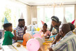 © Wavebreak Media - Happy african american family celebrating birthday, blowing candles