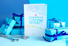 Greeting Card For Father's Day, Gifts And Wrenches On Color Background