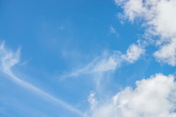 Wall Mural - scenic nature landscape with beautiful cirrus clouds in blue sky. colorful cloudscape with spindrift