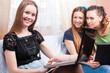 © danmorgan12 - Group of Three Young Positive Laughing Caucasian Girlfriends Having Fun With Personal Laptop Computer Indoors.