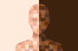 Silhouettes with dark and light skin assembled from puzzle pieces