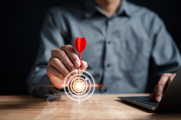 Fototapete - Businessman aiming red arrow dart to business target strategy dartboard for business investment planning development leadership and customer target group...