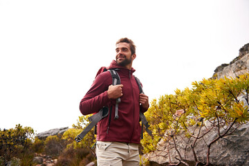Poster - He loves to hike. a young man enjoying a hike through the mountains.
