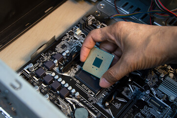 Poster - top view technician inserting cpu, computer assembler