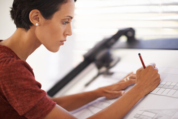 Poster - Totally focused on the design. an attractive young architect working in her office.