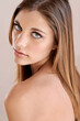 © A.B./peopleimages.com - Beguiling beauty. Studio portrait of an attractive model gazing at the camera.