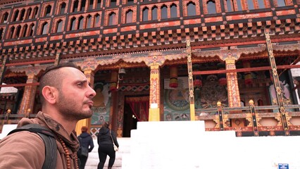 Tourist man walking inside the Tashichho Dzong in Thimphu, Bhutan