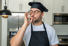 Man Chef Cooker, Baker. Man Chefs With Sign Of Perfect Food. Chef Man Cooking, Showing Sign For Delicious. Chef, Cook Making Tasty Delicious Gesture By Kissing Fingers. Chefs Cook In Hat And Apron
