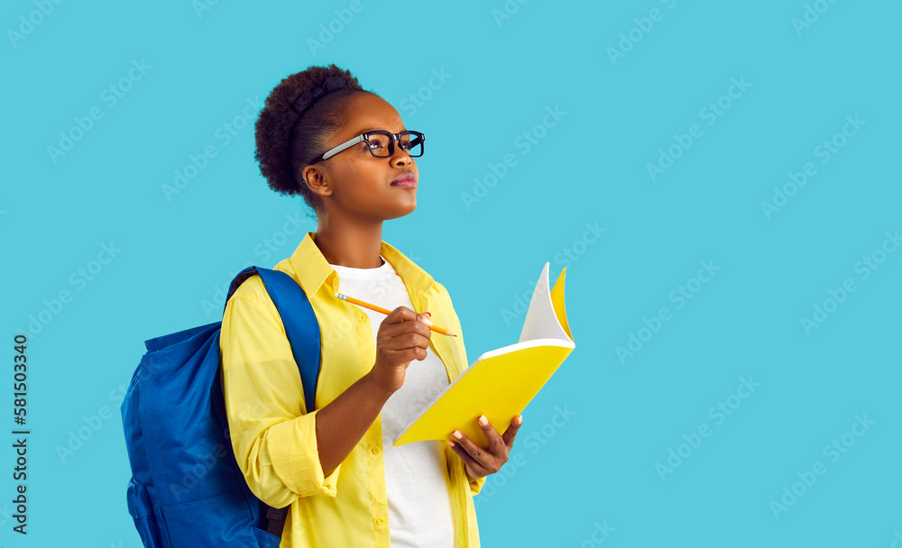 Portrait happy beautiful African American student girl in yellow shirt ...