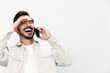 © SHOTPRIME STUDIO - Closeup portrait man talking on the phone smile with teeth happiness and laughter on white isolated background, fashion style clothes, copy space, space for text