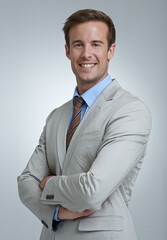 Poster - Always professional. A confident young businessman standing with his arms folded.