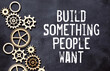 Build something people want.text on white notepad on craft background