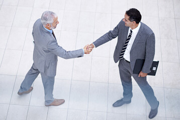 Aufkleber - The start of a great working relationship. High angle shot of a two businessmen shaking hands.