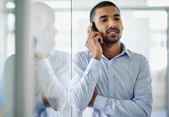 Poster - Thats what I like to hear. a handsome young businessman talking on his cellphone in the office.