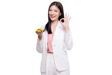 Happy Young Asian Business Look Woman Shows Yellow Mock Up Car With OK Hand Sign Isolated On Transparent Background, PNG File Format.