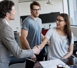 Poster - Its good to meet you. an attractive young businesswoman meeting her new boss.