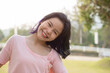 © nareekarn - Happy teen girl 11-15 year old. Portrait of beautiful woman smiling with perfect smile and white teeth and looking away at park during sunset. Smile face asian lady girl wear casual cloth.