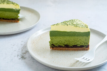 Wall Mural - Matcha layer cheesecake top with whipped cream with a sprinkle of matcha powder on top