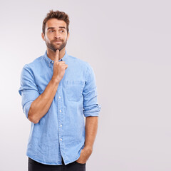 Aufkleber - Yes, that is a good idea...Studio shot of a handsome male looking thoughtful.