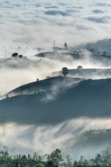 Wall Mural - Fanciful scenery of an early morning when the sun rises over the Dai Lao mountain range, Bao Loc district, Lam Dong province, Vietnam