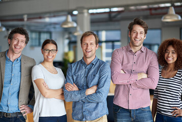 Poster - Were a team that stand by each other. A row of friendly looking professionals in their office posing proudly.