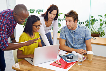 Poster - Brainstorming the project. a young designers at work in an office.