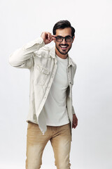 Poster - Man fashion portrait in glasses smile with teeth joy on a white isolated background, trendy clothing style, copy space, space for text