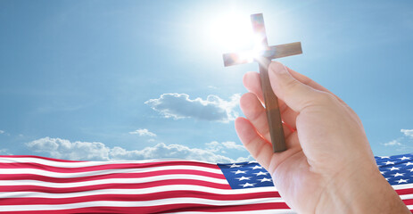 Wall Mural - Good Friday concept. Cross in arm on sky background. USA flag. 3d illustration.