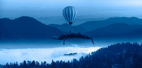 Wall Mural - A hot air balloon carries a humpback whale - Beautiful landscape with blue misty silhouettes of mountains 