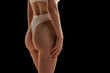 © Lustre Art Group  - Back view of cropped female body in white inner wear isolated over dark background. Anti-cellulite care cosmetology. Concept of beauty, body care, health, plastic surgery