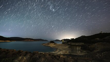Poster - epic star lapse over high island west dam sai kung hong kong with burst of light on horizon