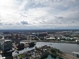 Fototapeta Sawanna - Aerial view of modern buildings and landmarks next to the river. Taken in Salford Quays England. 