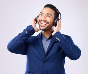 Sticker - Executive man, music headphones and thinking on studio background of happiness, motivation and inspiration. Happy corporate worker listening to audio, sound and business podcast on radio with smile