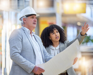 Poster - Man, woman and pointing at construction site for blueprint ideas, industrial design or collaboration. Team discussion, building management and engineering of infrastructure, architecture and planning