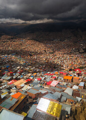 Wall Mural - vertical of El Alto in La Paz, Bolivia, Aerial Drone Fly Above Populated Town in South America, Cityscape of Houses and Spectacular High Altitude Slum Buildings