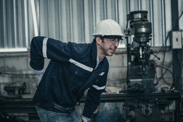 The adult foreman suffered from a back injury while lifting and carrying heavy machinery and keeping a twisted posture. Muscles can get strained, overused through continuous, repetitive movements.