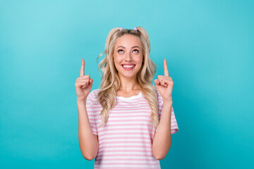 Sticker - Portrait of gorgeous positive lady look direct fingers up empty space isolated on emerald color background