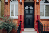 Fototapeta Londyn - Black front door of a traditional house in London, UK.