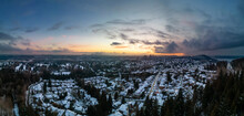 Modern City Suburban Neighborhood Covered In Snow. Burnaby, Vancouver, BC, Canada. Aerial Panorama. Winter Sunset