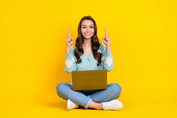 Sticker - Full length photo of pretty shiny lady dressed teal cardigan chatting gadget pointing up empty space isolated yellow color background