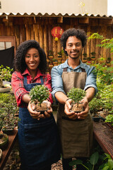 Wall Mural - portrait of couple standing and smiling at plant nursery