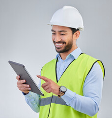 Poster - Construction worker, engineer and happy man in studio with tablet and helmet safety on white background. Smile, internet and contractor or architect in online planning for project management in India